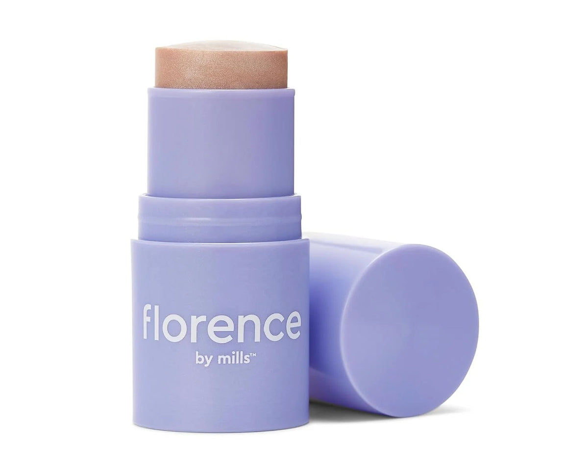 Purple skincare stick with 'florence by mills' branding on a white background