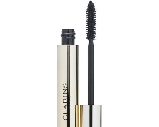 Clarins mascara with its metallic gold and silver tube, shown open with the black mascara wand and brush visible against a white background.