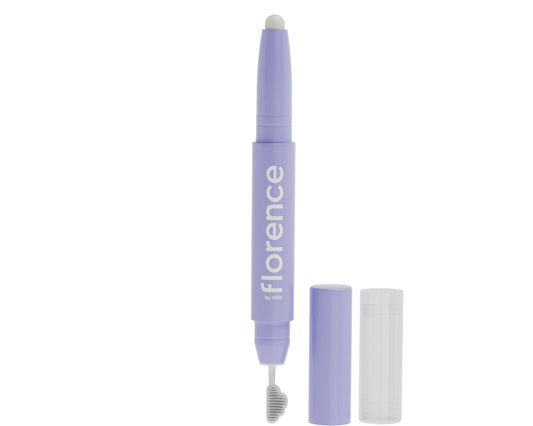 A lavender lip gloss pen with the brand name 'florence by florence' printed vertically on the barrel, shown alongside its separate cap and clear outer sleeve on a plain white background.
