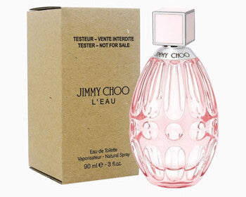 Pink perfume bottle with 'Jimmy Choo' branding next to its packaging on a white background